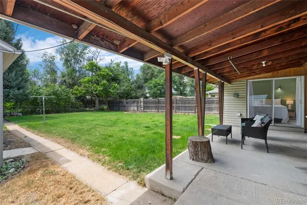a view of yard with patio