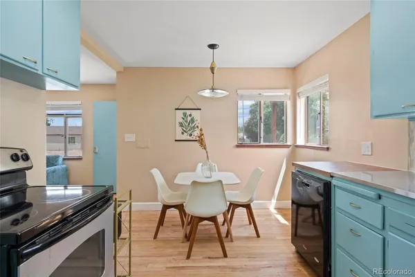 a view of a dining room with furniture window and wooden floor