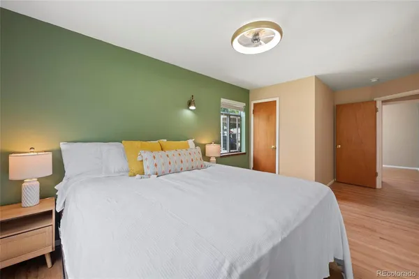 a bed room with a bed and a lamp