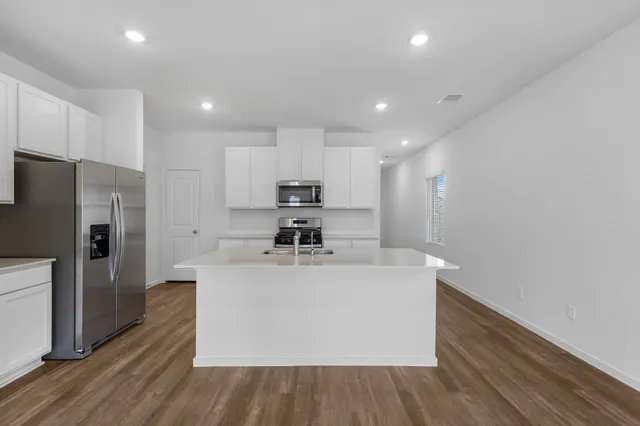 a view of storage and utility room with washer and dryer