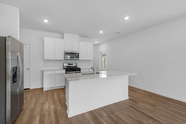 a bathroom with a sink mirror and toilet