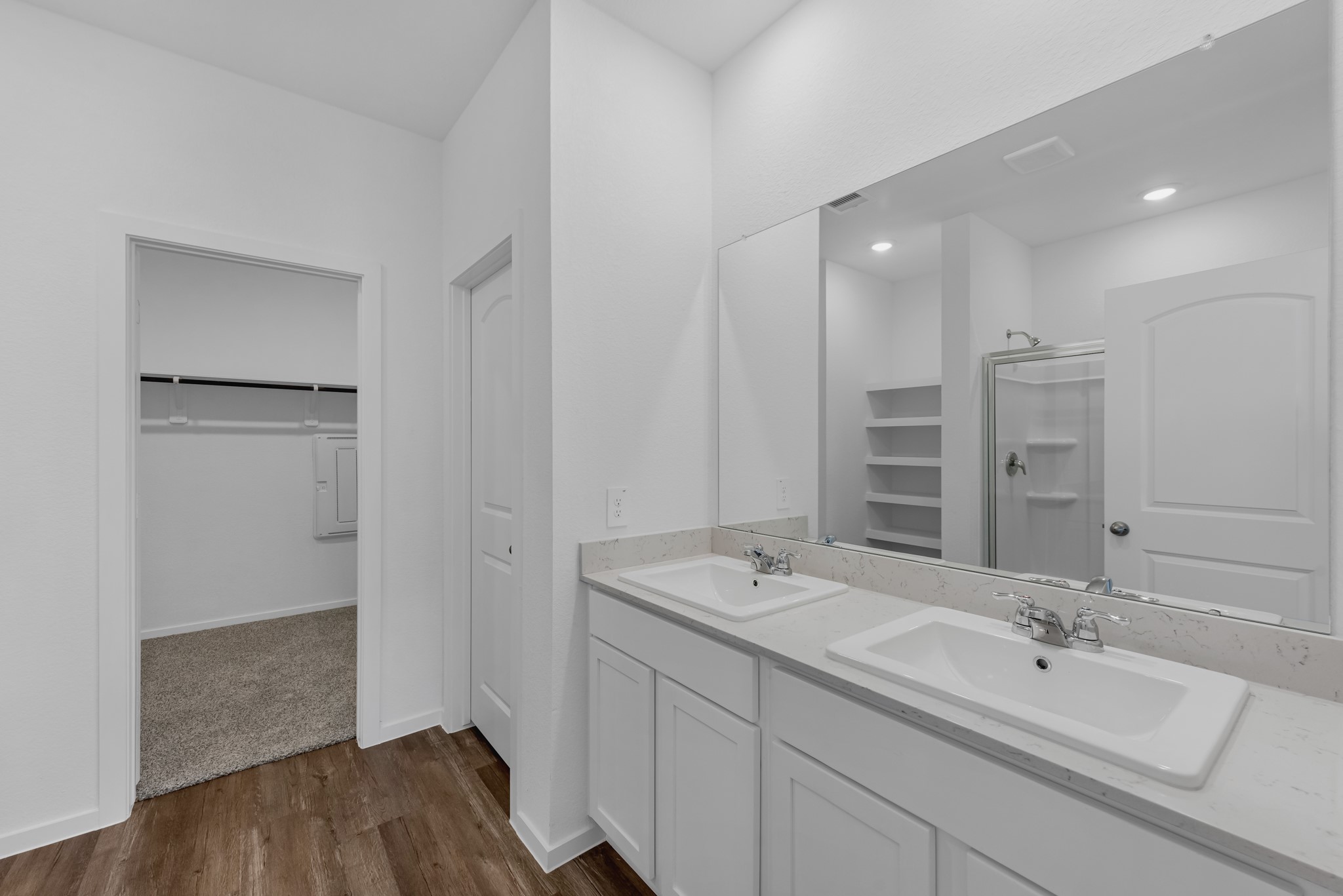 21915 Terre Riviera Drive Hockley, TX 77447 - Photo 21 of 33 a bathroom with a double vanity sink a and mirror