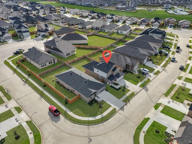 a kitchen with stainless steel appliances kitchen island granite countertop a stove and a refrigerator