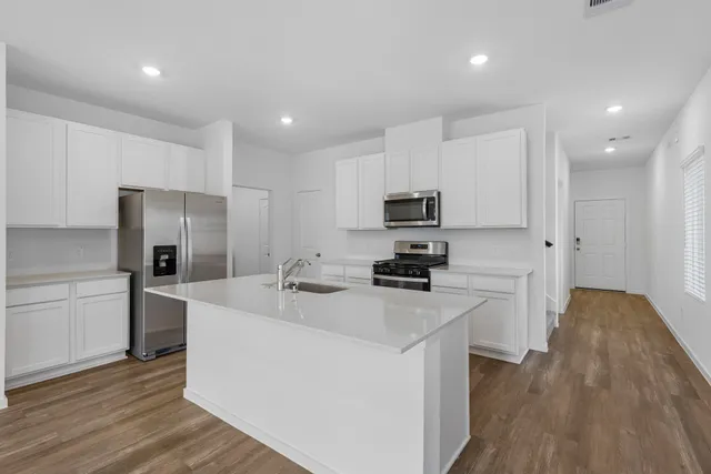 a view of kitchen with wooden floor