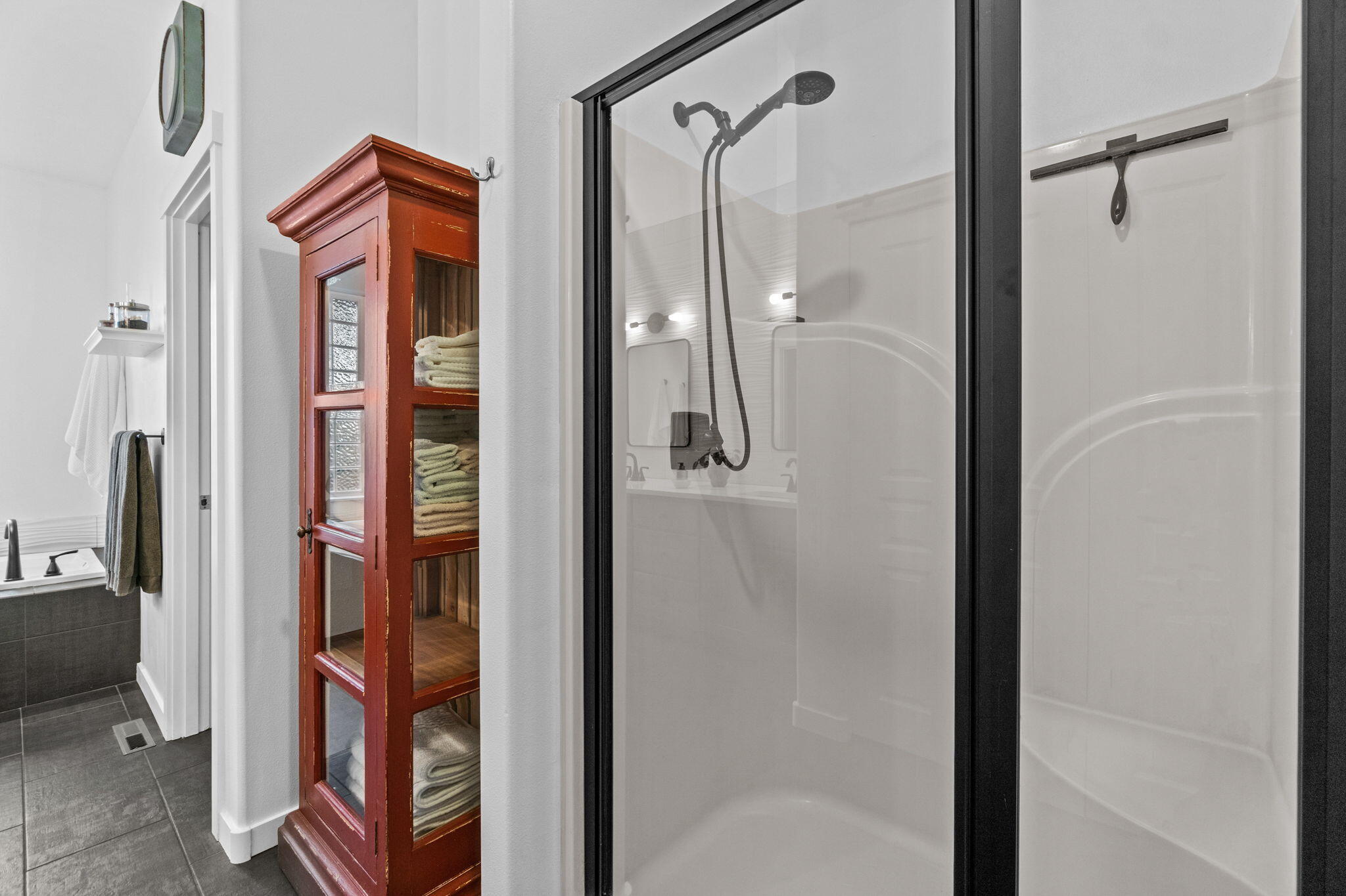 10942 Village Loop Redmond, OR 97756 - Photo 27 of 45 a bathroom with a glass shower door