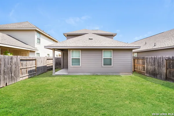 a kitchen with stainless steel appliances a stove top oven a sink a refrigerator and cabinets