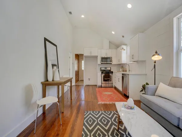 a living room with furniture and a table