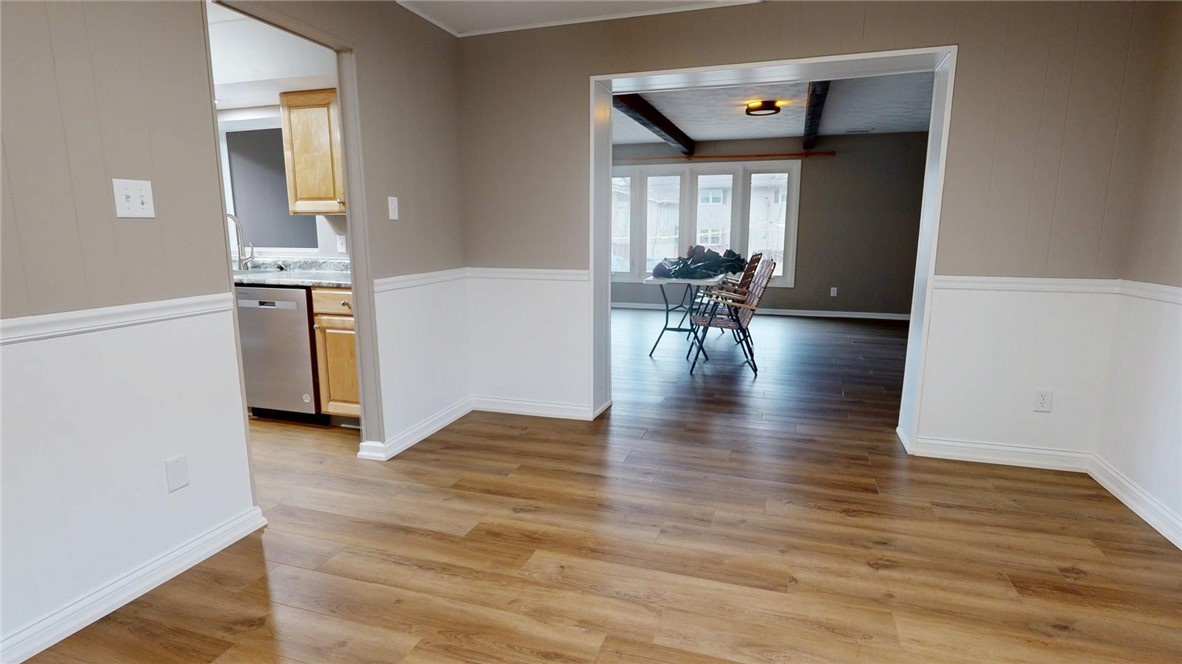 4153 Buckingham Drive Decatur, IL 62526 - Photo 10 of 34 a view of a living room and dining room with wooden floor