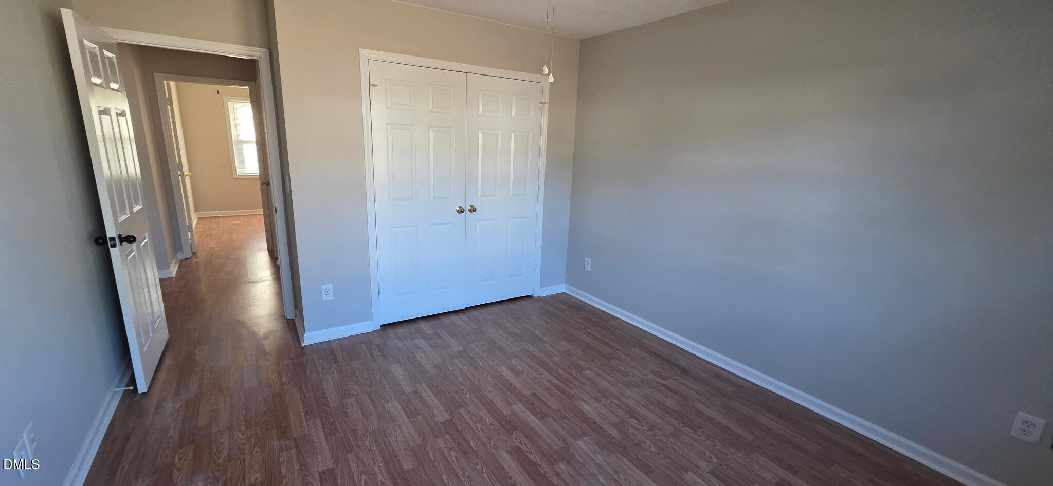 601 West Anderson Street Selma, NC 27576 - Photo 5 of 7 a view of a hallway with wooden floor and a glass door