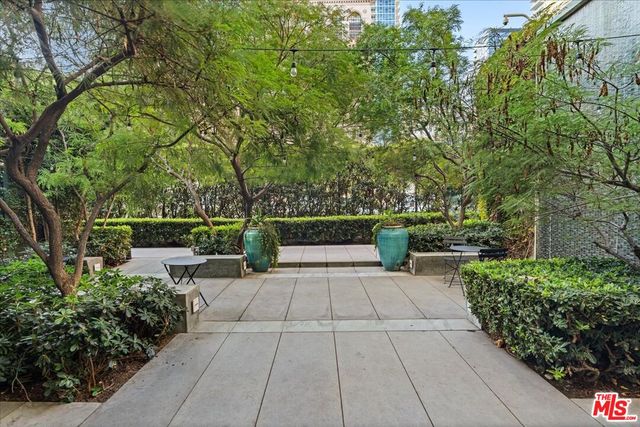 a view of a swimming pool with outdoor seating