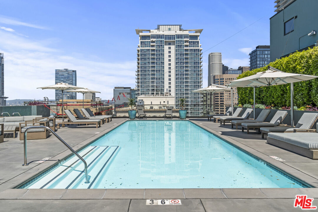 849 South Broadway, Unit 604 Los Angeles, CA 90014 - Photo 35 of 43 a view of a swimming pool with outdoor seating