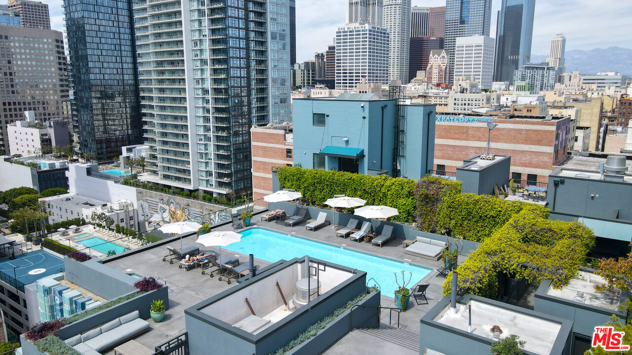 849 South Broadway, Unit 604 Los Angeles, CA 90014 - Photo 38 of 43 a view of a patio with couches table and chairs potted plants