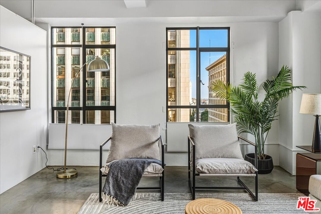 849 South Broadway, Unit 604 Los Angeles, CA 90014 - Photo 8 of 43 a living room with furniture