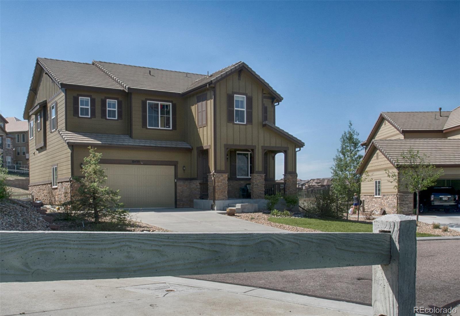 10459 Meadowleaf Way Highlands Ranch, CO 80126 - Photo 33 of 33 a front view of a house with a yard