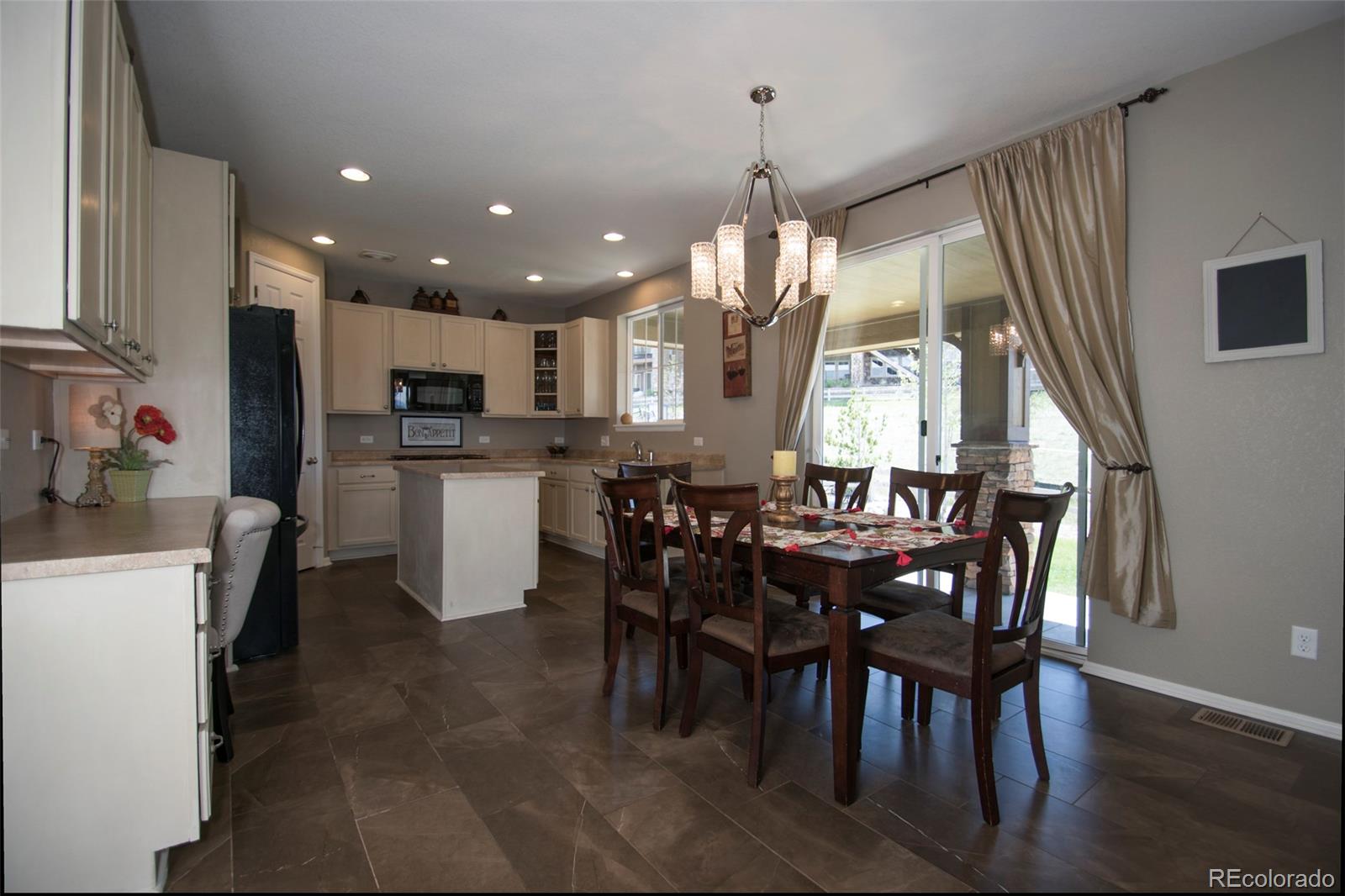 10459 Meadowleaf Way Highlands Ranch, CO 80126 - Photo 4 of 33 a view of a dining room with furniture