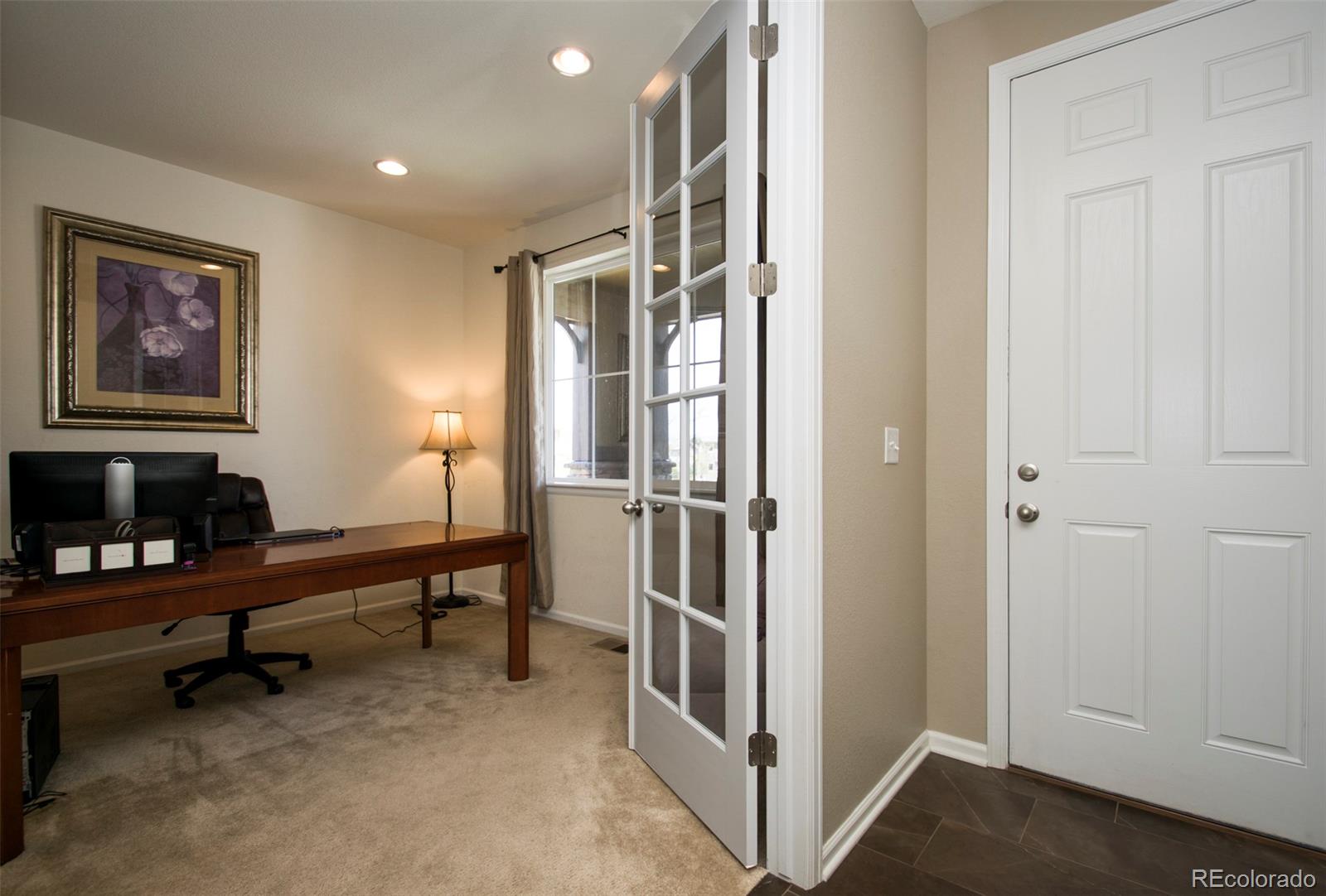 10459 Meadowleaf Way Highlands Ranch, CO 80126 - Photo 10 of 33 a view of a workspace with furniture and a window