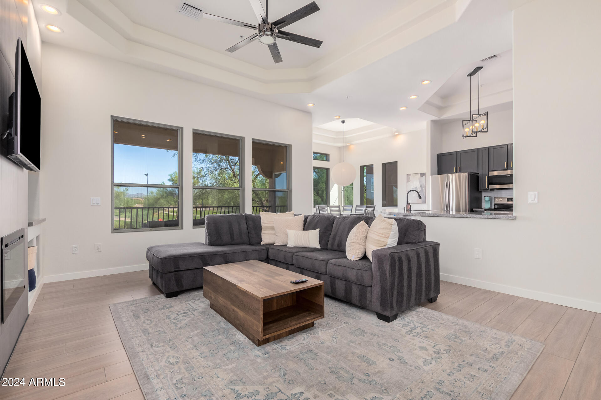 8245 East Bell Road, Unit 240 Scottsdale, AZ 85260 - Photo 4 of 28 Vaulted ceilings and custom lighting