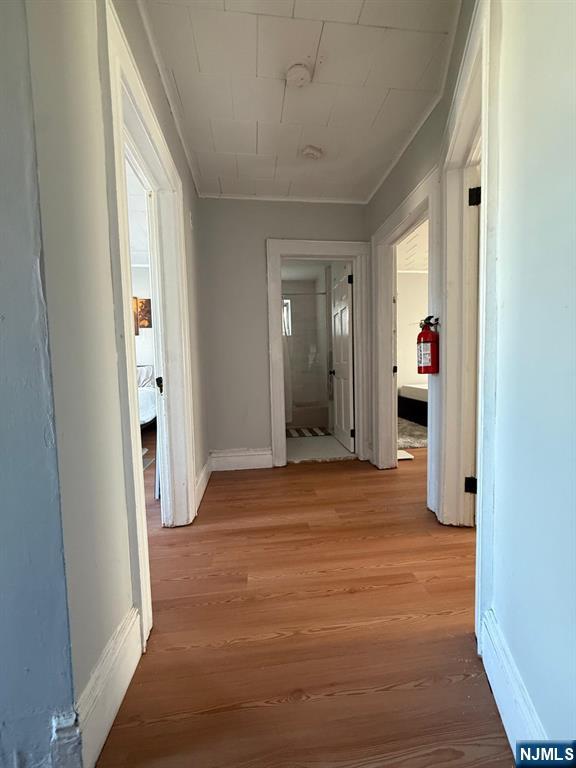 365 3rd Street Clifton, NJ 07011 - Photo 19 of 31 a view of a hallway with wooden shelves
