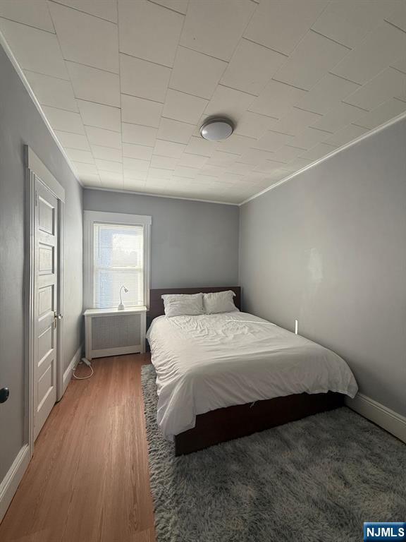 365 3rd Street Clifton, NJ 07011 - Photo 21 of 31 a bedroom with a bed and a window