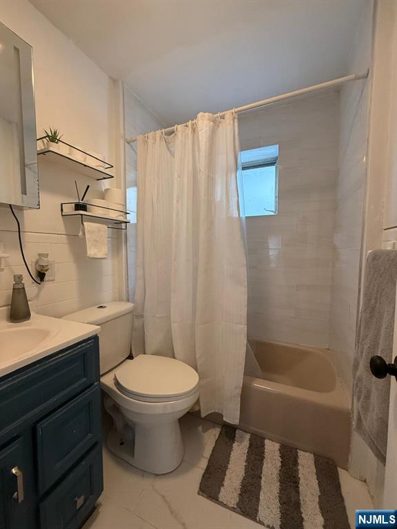 365 3rd Street Clifton, NJ 07011 - Photo 23 of 31 a bathroom with a sink a toilet and shower