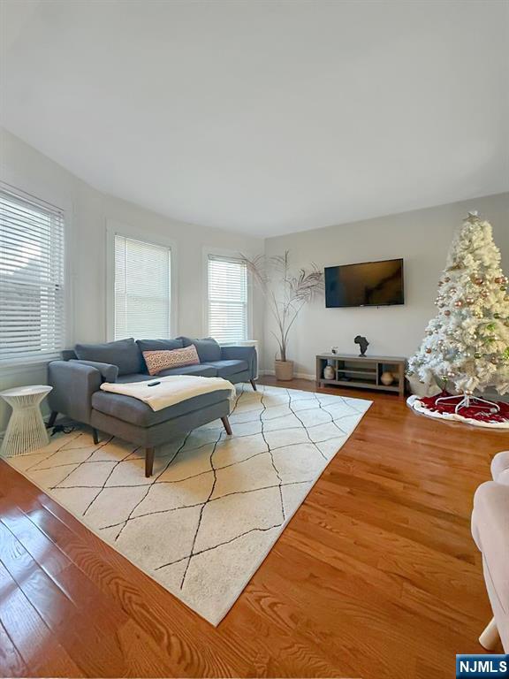 365 3rd Street Clifton, NJ 07011 - Photo 4 of 31 a living room with furniture and a flat screen tv