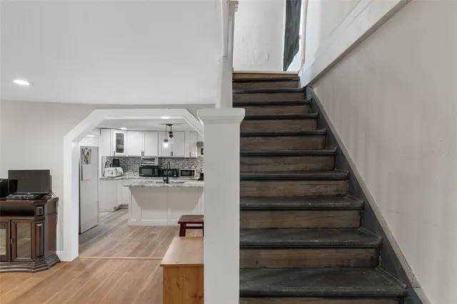 a view of room with wooden floor and cabinet
