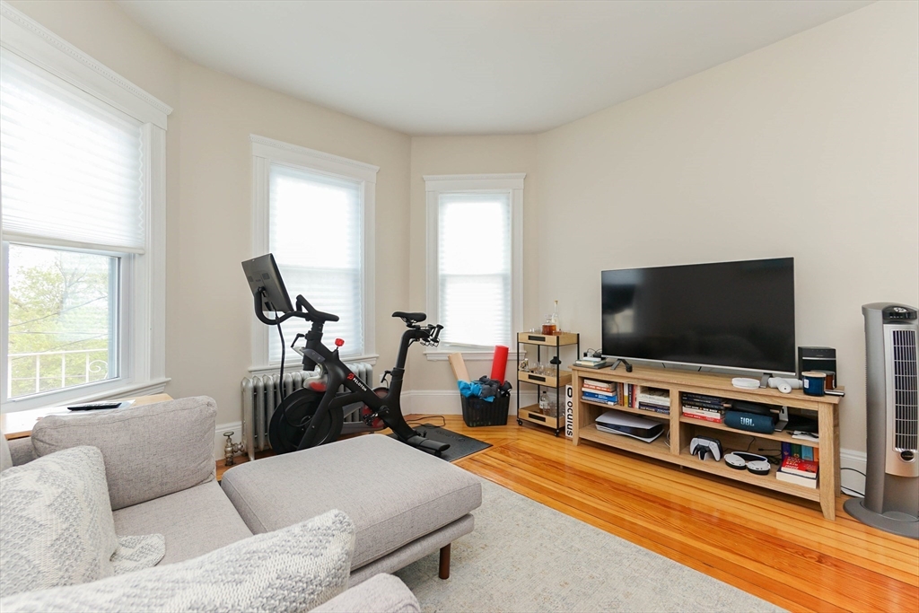 51 Main Street, Unit 2 Somerville, MA 02145 - Photo 13 of 23 a living room with furniture and a flat screen tv