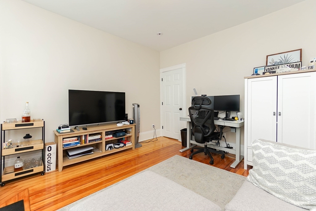 51 Main Street, Unit 2 Somerville, MA 02145 - Photo 14 of 23 a living room with furniture and a flat screen tv