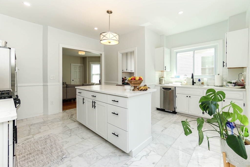 51 Main Street, Unit 2 Somerville, MA 02145 - Photo 3 of 23 a spacious en suite bathroom with double sink and a mirror
