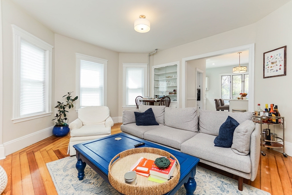 51 Main Street, Unit 2 Somerville, MA 02145 - Photo 6 of 23 a living room with furniture and a wooden floor