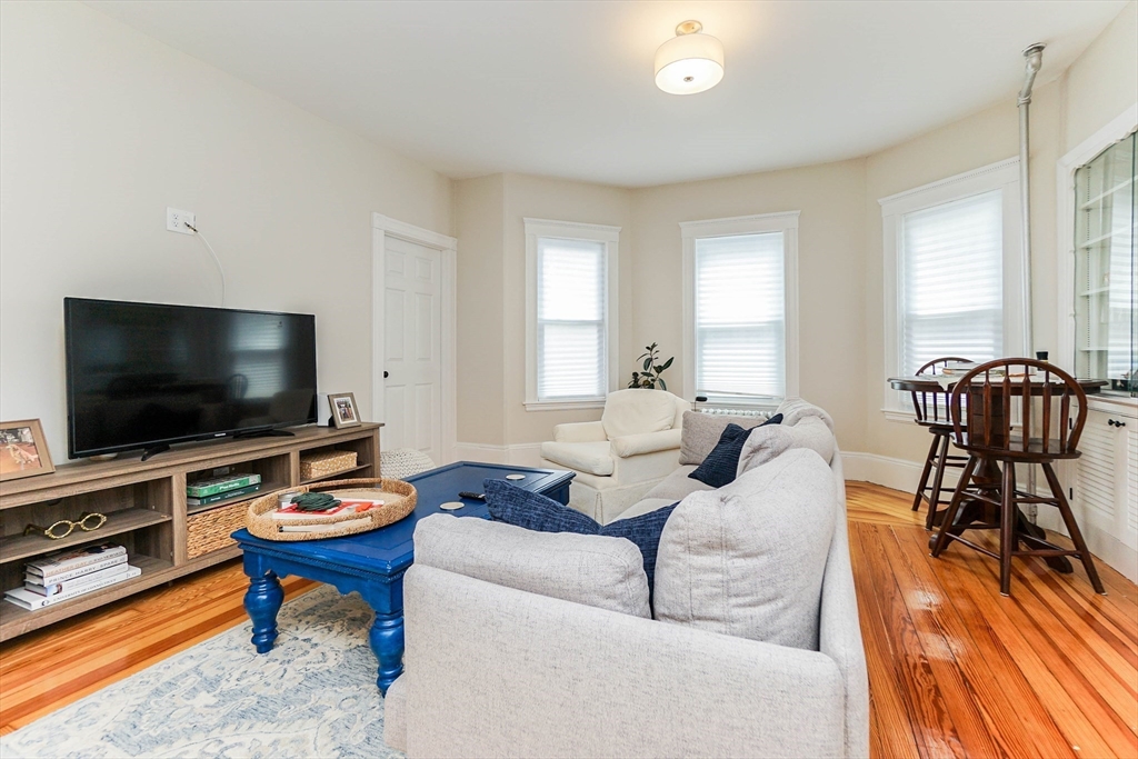 51 Main Street, Unit 2 Somerville, MA 02145 - Photo 8 of 23 a living room with furniture and a flat screen tv