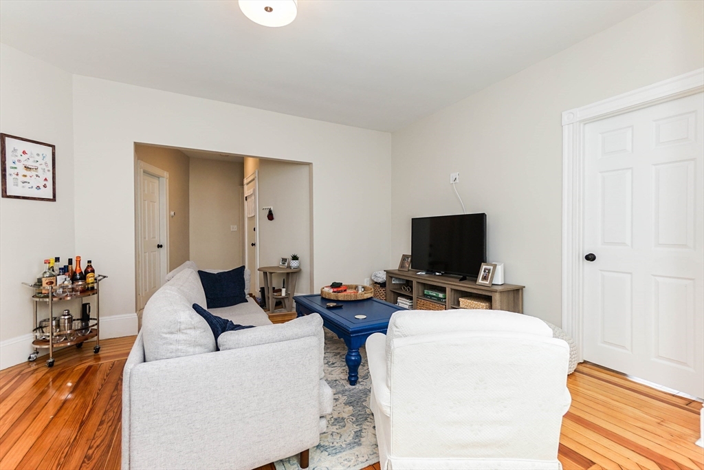 51 Main Street, Unit 2 Somerville, MA 02145 - Photo 9 of 23 a living room with furniture and a flat screen tv