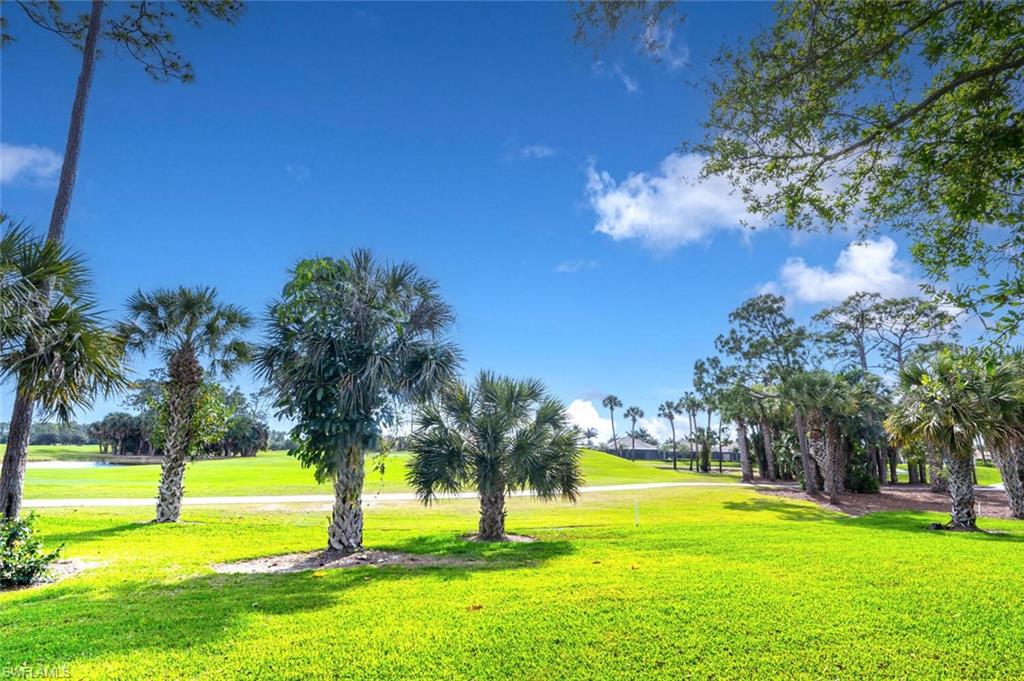 7563 Moorgate Point Way Naples, FL 34113 - Photo 27 of 50 a view of an ocean with a big yard