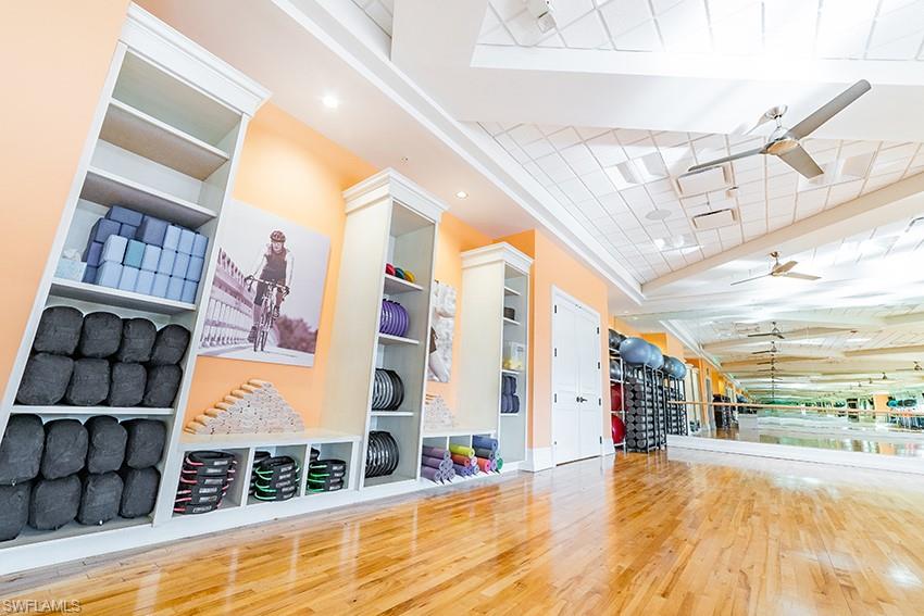 7563 Moorgate Point Way Naples, FL 34113 - Photo 35 of 50 a view of a building with a swimming pool