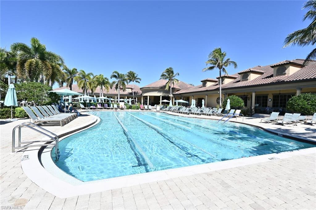 7563 Moorgate Point Way Naples, FL 34113 - Photo 41 of 50 a view of a swimming pool with a patio