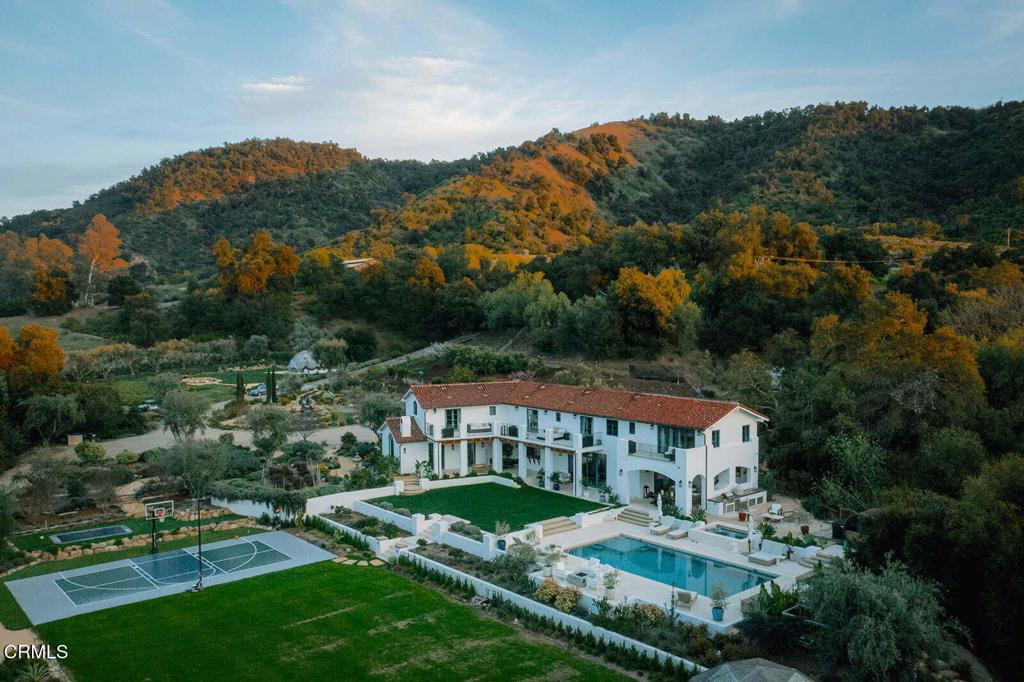 an aerial view of a house with a garden