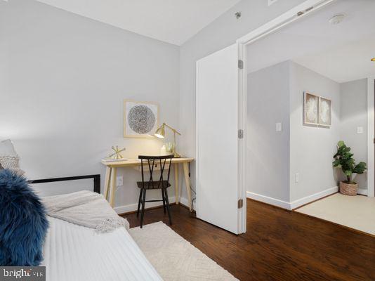 1150 K Street Northwest, Unit 709 Washington, DC 20005 - Photo 18 of 25 a workspace with furniture and wooden floor