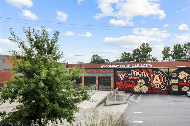 a front view of a building with garage