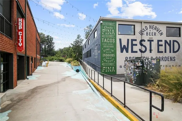 a view of a street with stores