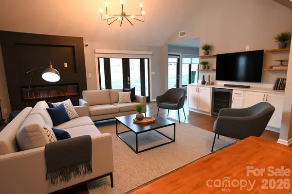a living room with furniture and a flat screen tv