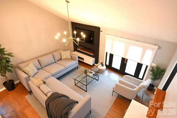 a living room with furniture and a flat screen tv