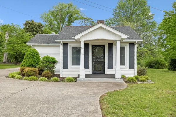 front view of a house with a yard