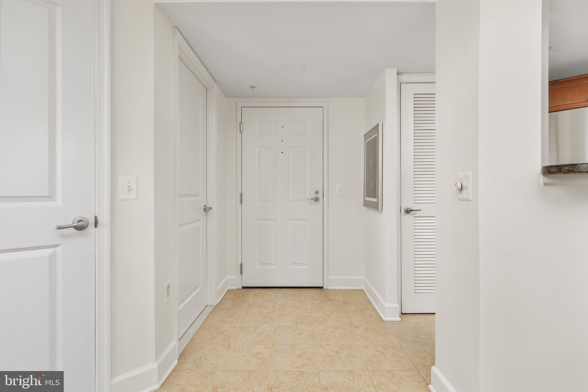 11800 Sunset Hills Road, Unit 815 Reston, VA 20190 - Photo 9 of 61 Ceramic Tile entry w Coat Closet