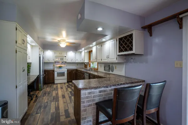 a kitchen with a table and chairs in it