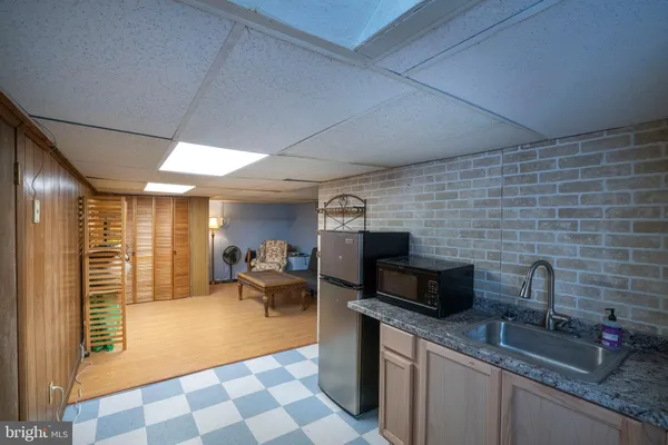 a kitchen with stainless steel appliances a refrigerator and a stove top oven