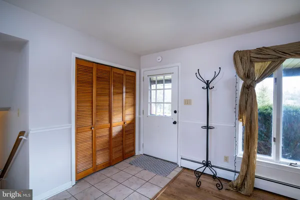 a view of a livingroom with a hardwood and a window