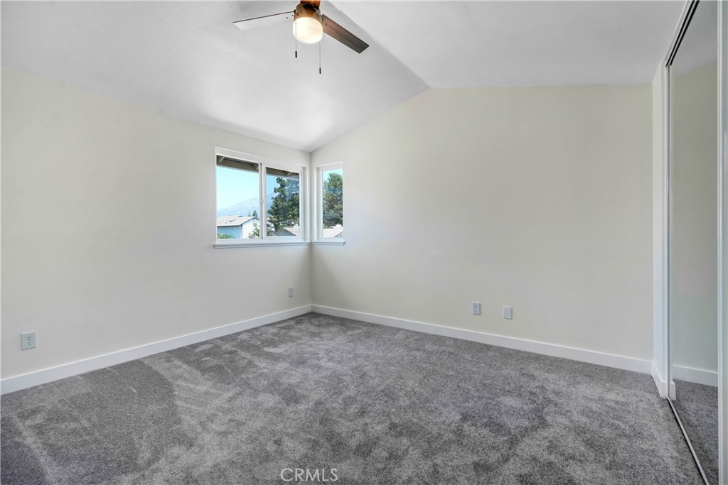 11629 Mt Jefferson Drive Rancho Cucamonga, CA 91737 - Photo 12 of 17 an empty room with windows and fan