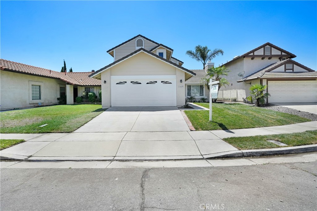 11629 Mt Jefferson Drive Rancho Cucamonga, CA 91737 - Photo 3 of 17 front view of a house with a yard