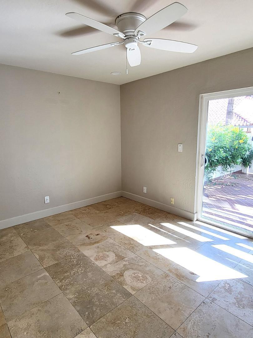 5770 North Scottsdale Road Paradise Valley, AZ 85253 - Photo 21 of 25 an empty room with a empty space and a ceiling fan