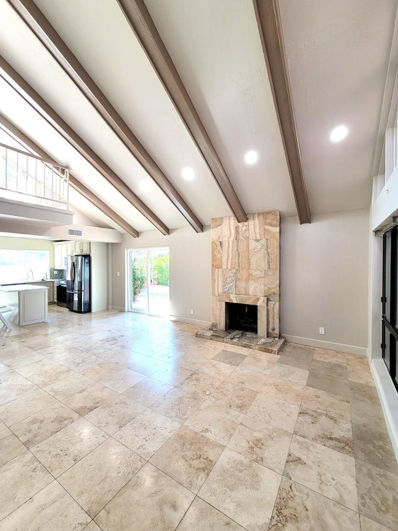 5770 North Scottsdale Road Paradise Valley, AZ 85253 - Photo 3 of 25 a view of a livingroom with a fireplace a chandelier and windows